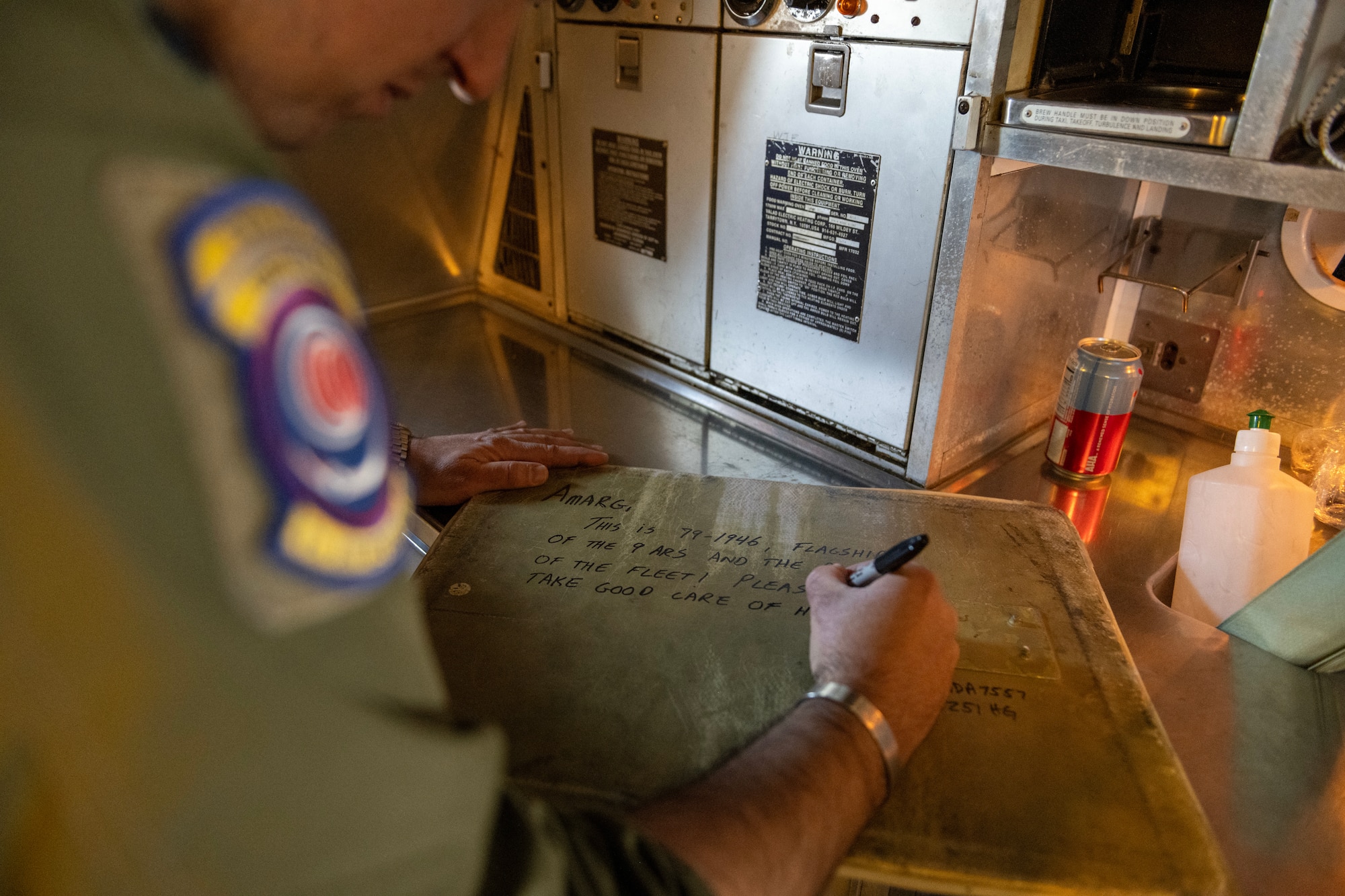 U.S. Air Force Lt. Col. Andrew Baer, 9th Air Refueling Squadron commander and KC-10 Extender pilot, leaves a note for the 309th Aerospace Maintenance and Regeneration Group (AMARG).