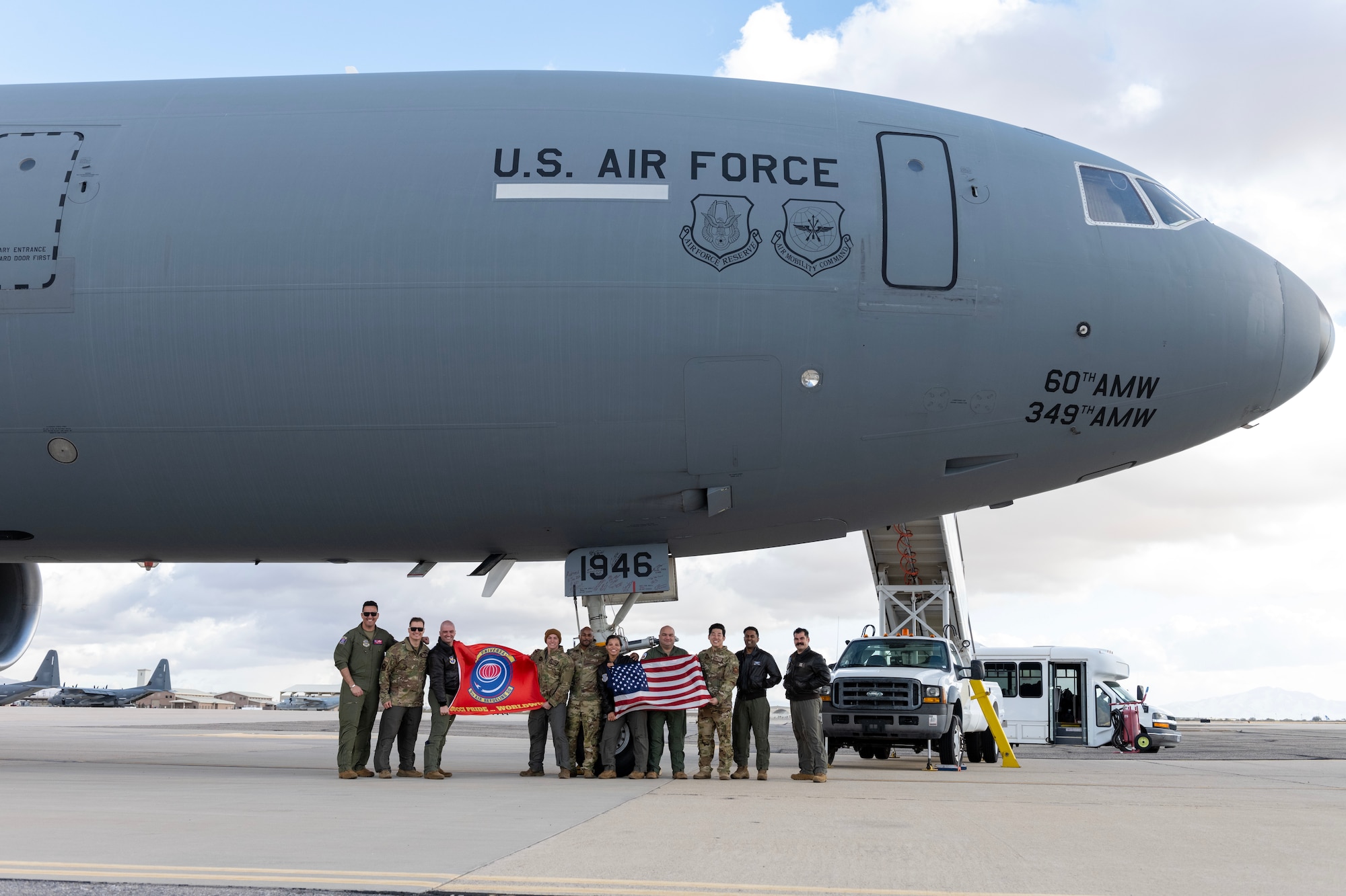 U.S. Airmen from the 9th Air Refueling Squadron from Travis Air Force Base, California, pose for a photo alongside a KC-10.