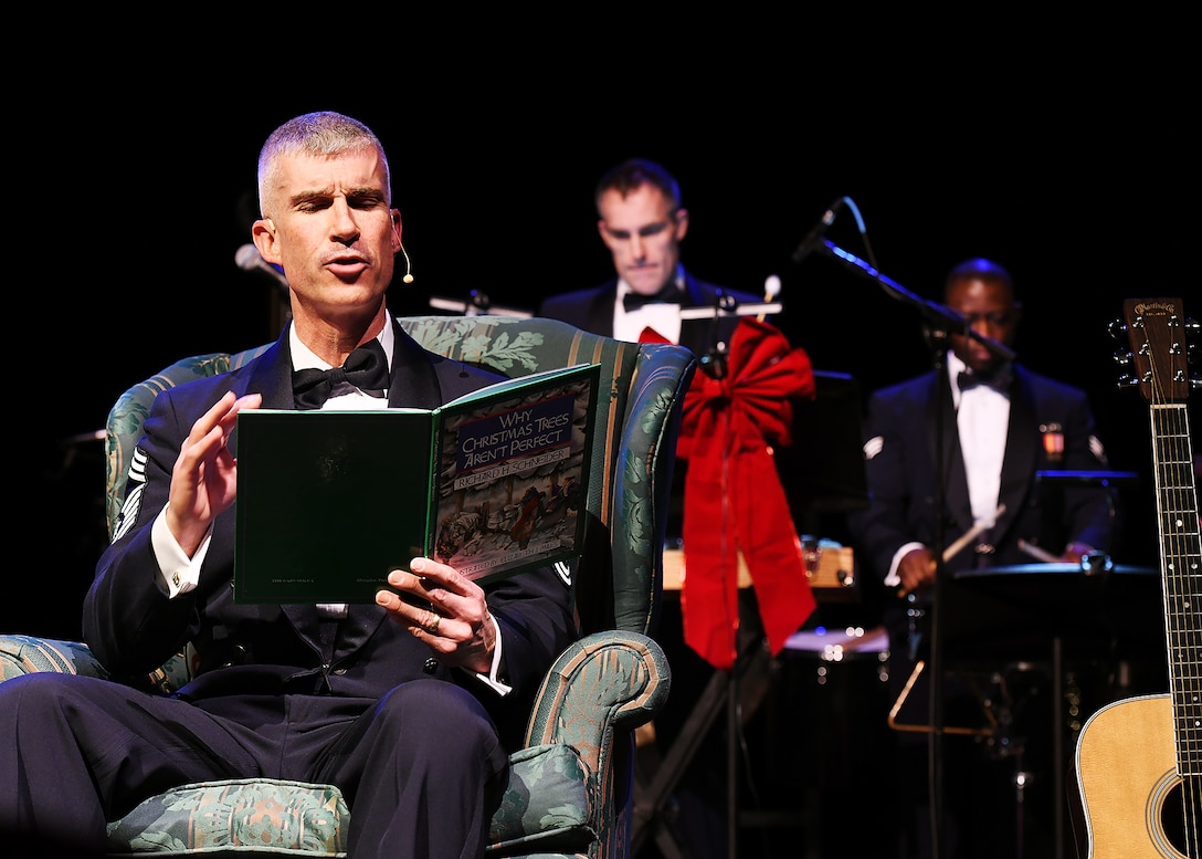 Chief Master Sergeant Jeremy Remley enthralls the crowd with his reading of a wonderful holiday story during Sounds of the Season 2023.