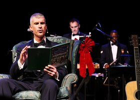 Chief Master Sergeant Jeremy Remley enthralls the crowd with his reading of a wonderful holiday story during Sounds of the Season 2023.
