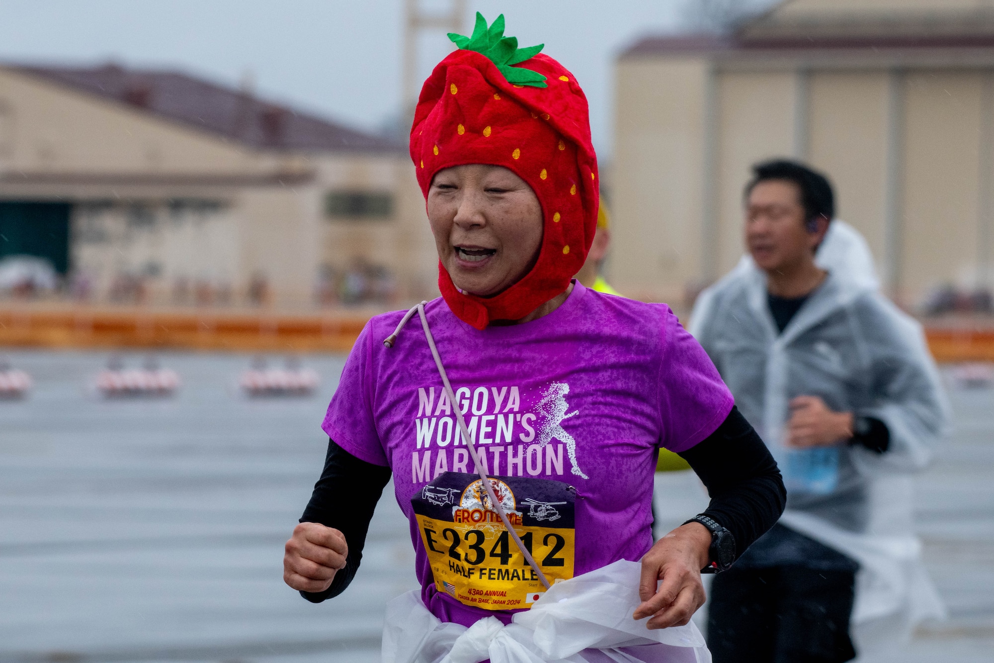 A participant in the half-marathon event makes their way down the flightline.