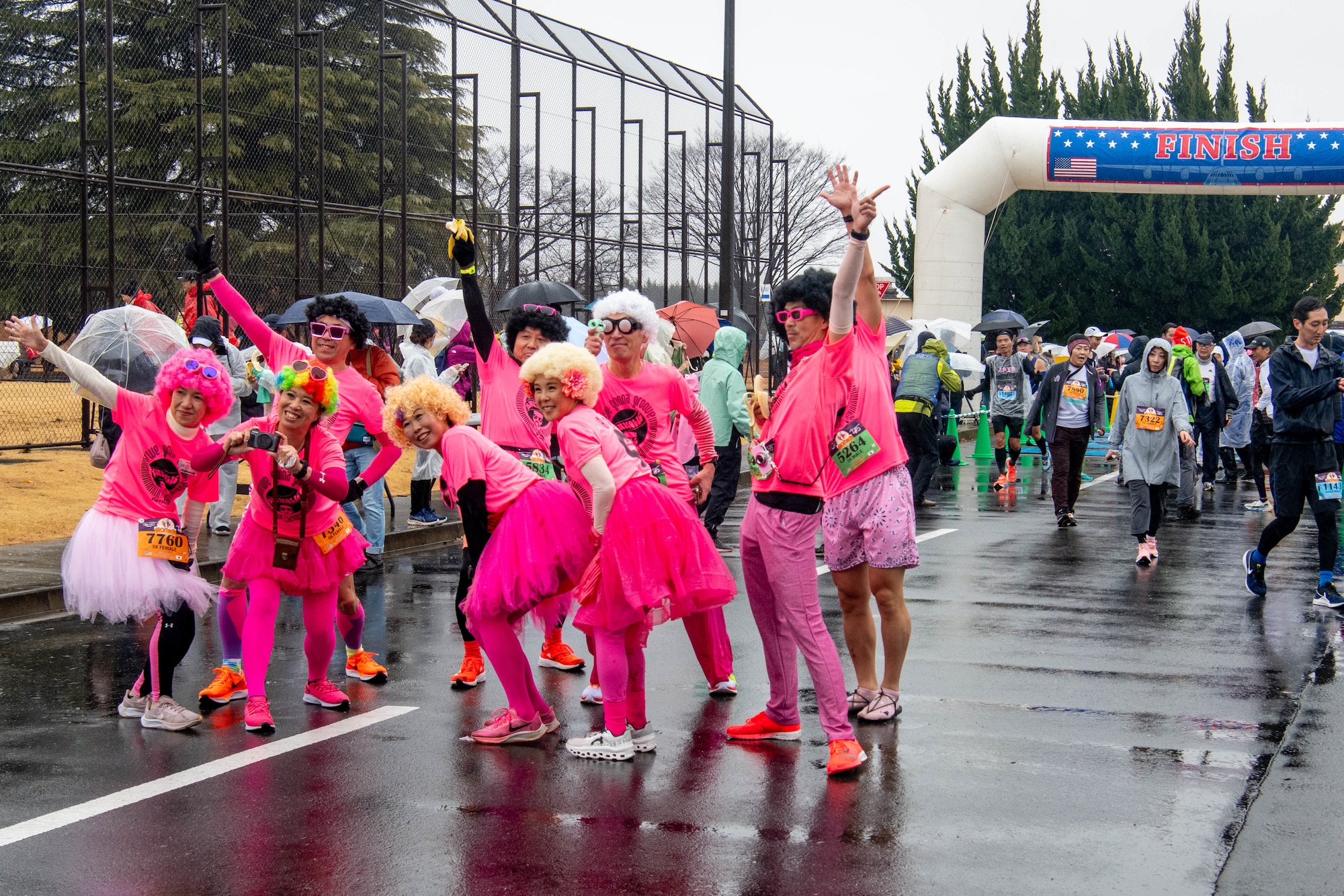 Runners participating in the 5K road race pose for a photo.