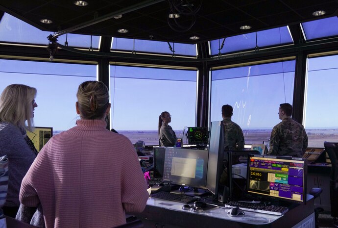 U.S. Air Force 9th Operations Support Squadron members look out from the air traffic control tower Jan. 11, 2024, at Beale Air Force Base, California.