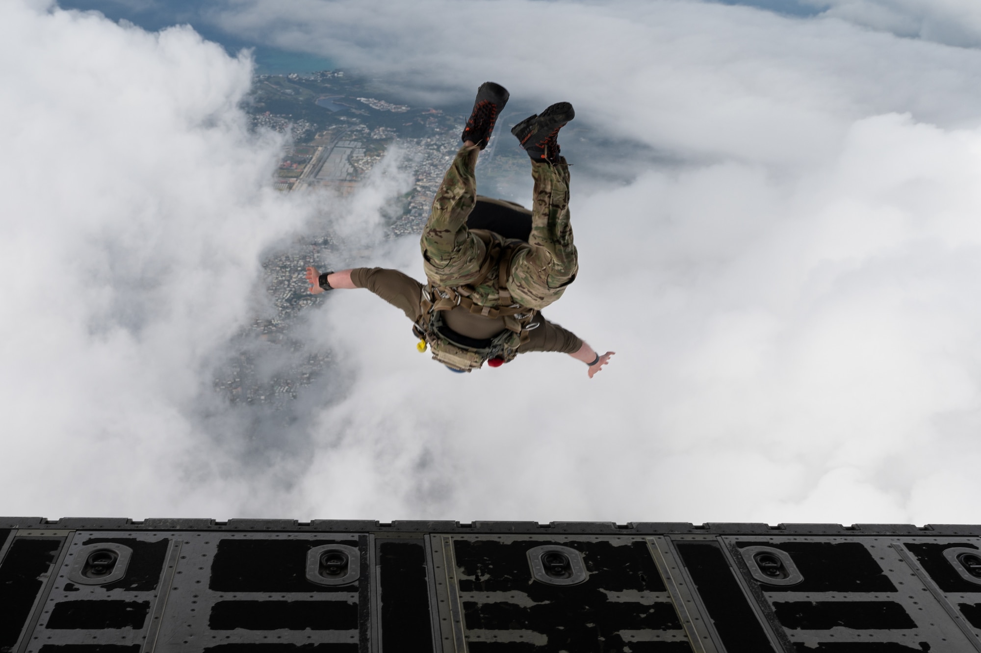 A pararescueman jumps from an MC-130J