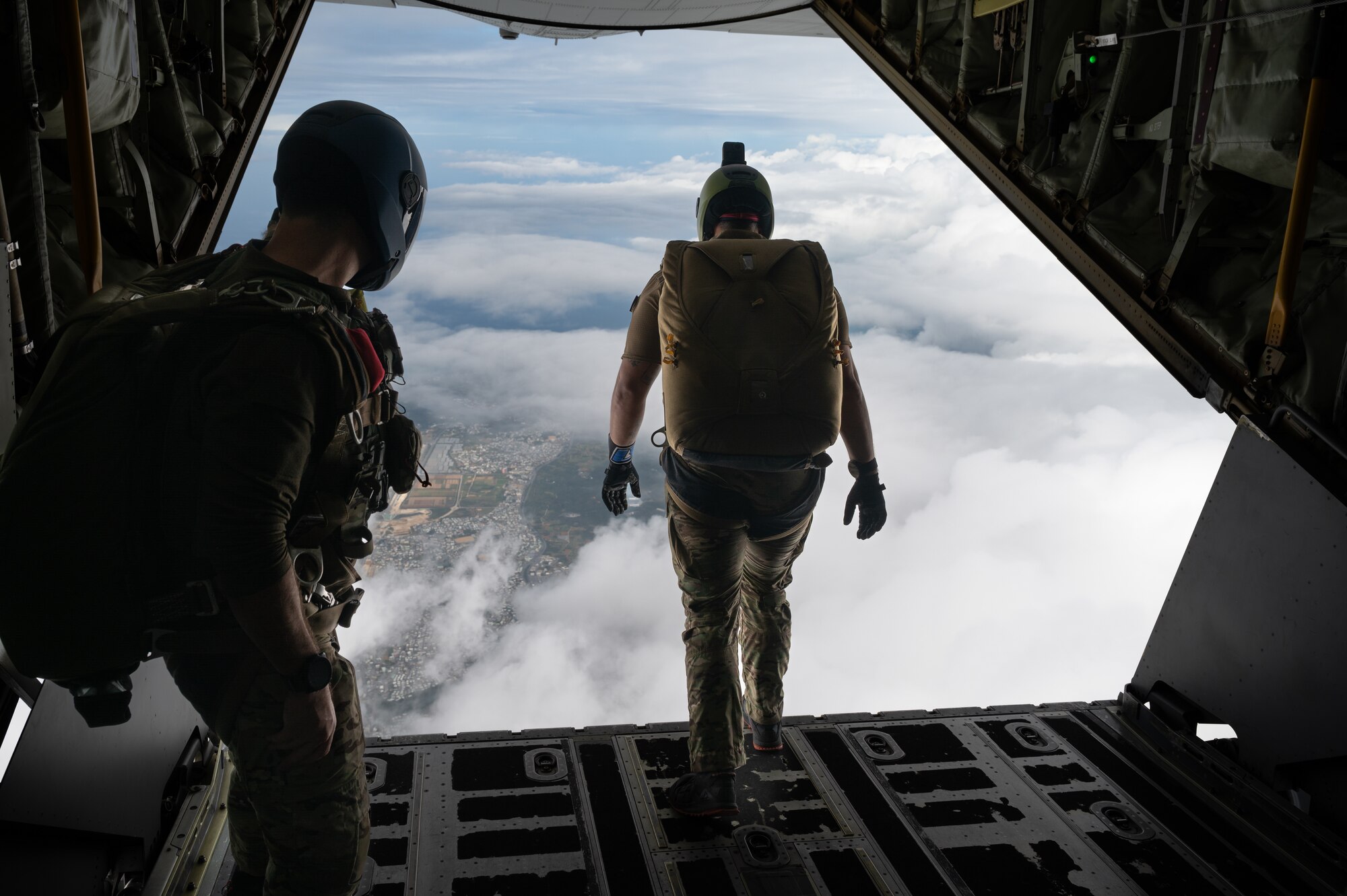 Pararescuemen jump of an MC-130J Commando II.