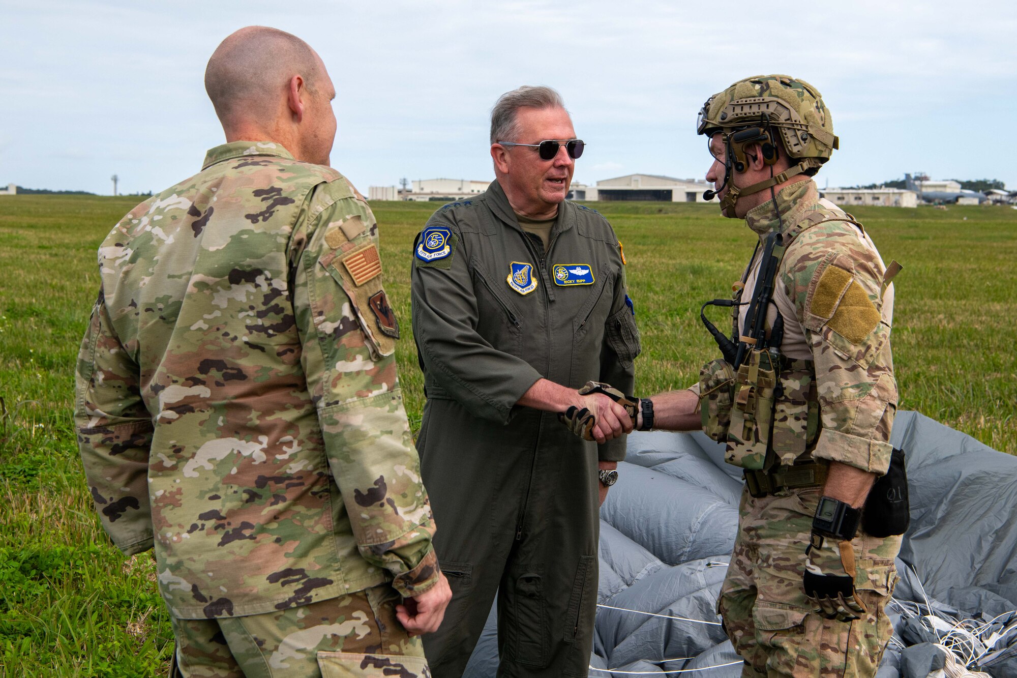 Lt. Gen. Ricky Rupp congratulates a pararescueman.