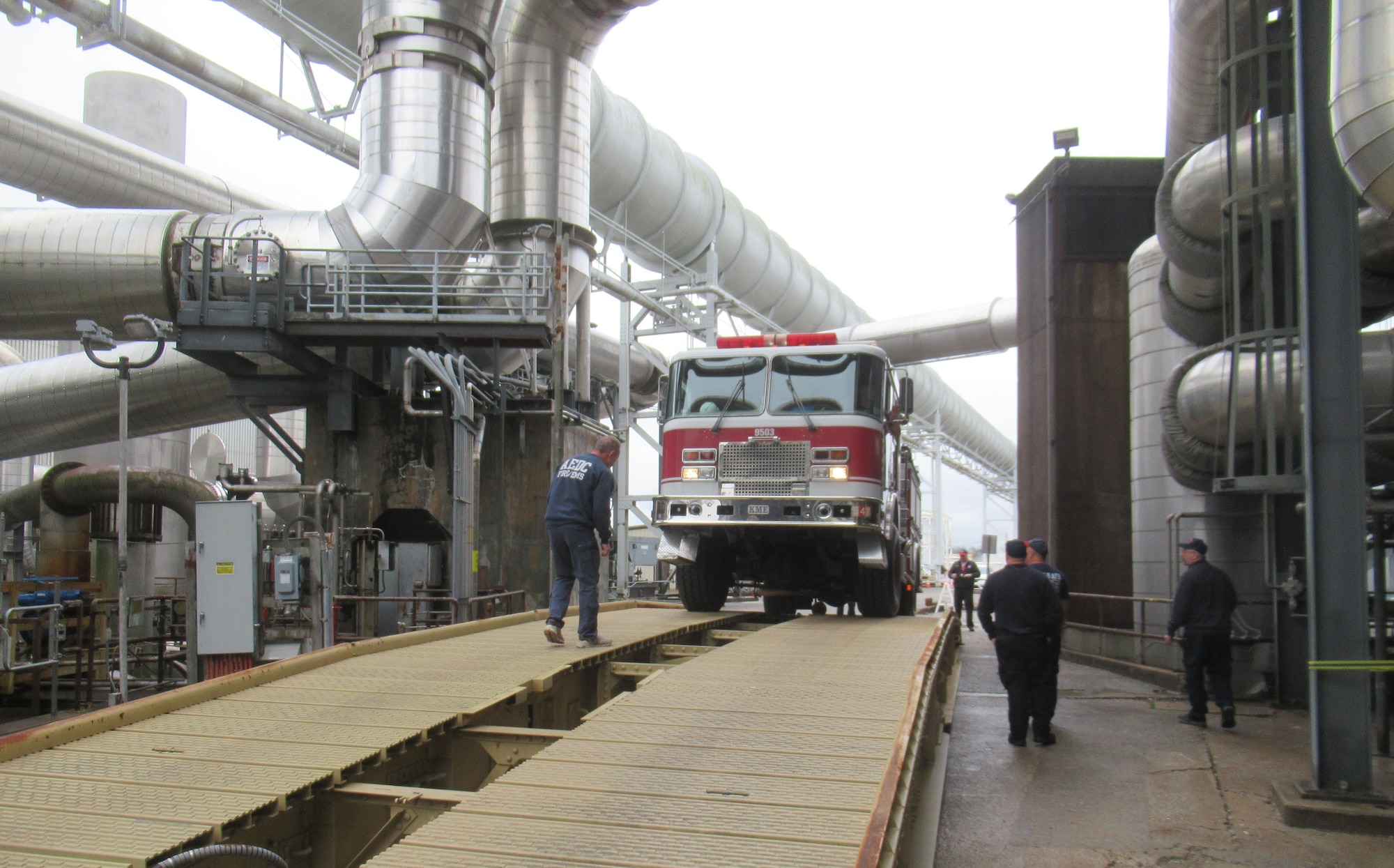 To test its ability to cross in case of an emergency, a fire truck from Arnold Air Force Base Fire and Emergency Services is driven across the bridge component of an Armored Vehicle Launched Bridge Jan. 6, 2024, at Arnold AFB, Tenn. AVLBs carry a deployable bridge and are designed to allow tanks, infantry fighting vehicles and other tactical vehicles to cross small rivers, gaps and other terrain obstacles on the battlefield. The AVLB was commercially delivered to Arnold from Fort Campbell, Ky., on Nov. 30, 2023, and was needed to move a large crane across an Arnold alleyway where the axle load limit was less than the weight of the crane. The AVLB was operated by a Guardsman with the 190th Engineer Company of the Tennessee National Guard, while Guardsmen from the 194th Engineer Brigade directed and guided the operation. (U.S. Air Force photo)