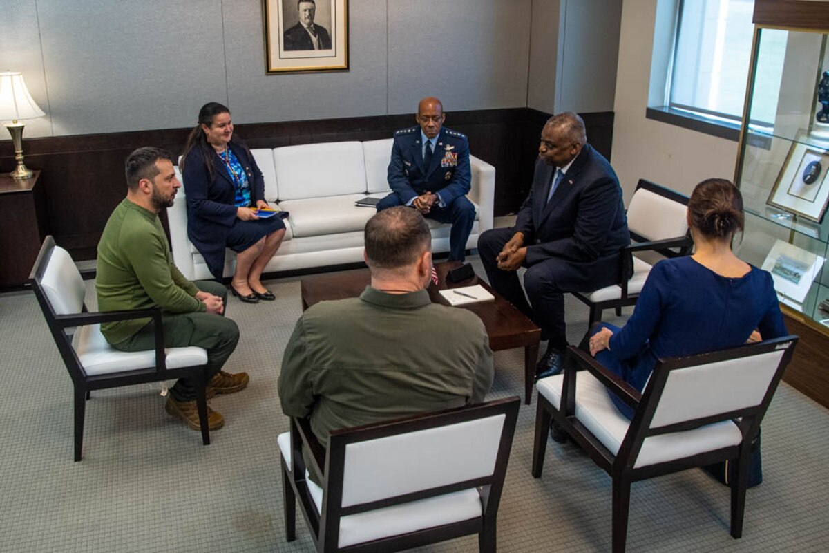 A group of people are seated in a room.