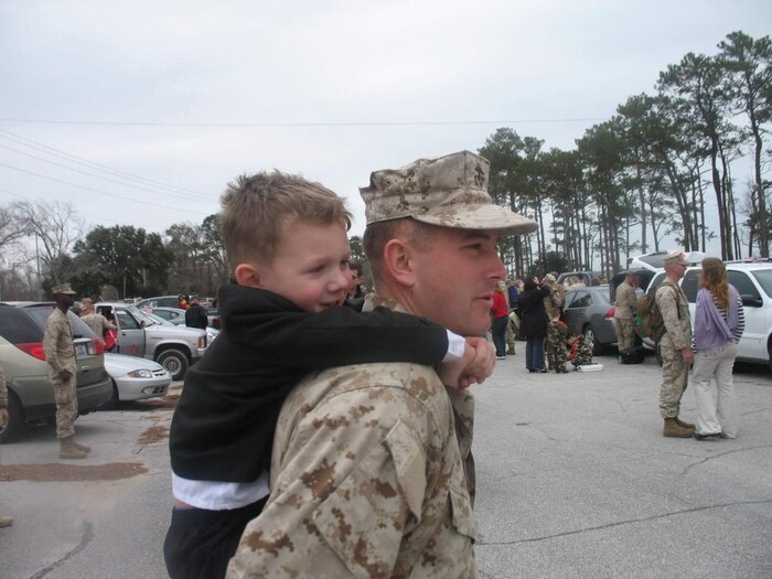 A U.S. Marine reunites with his son.