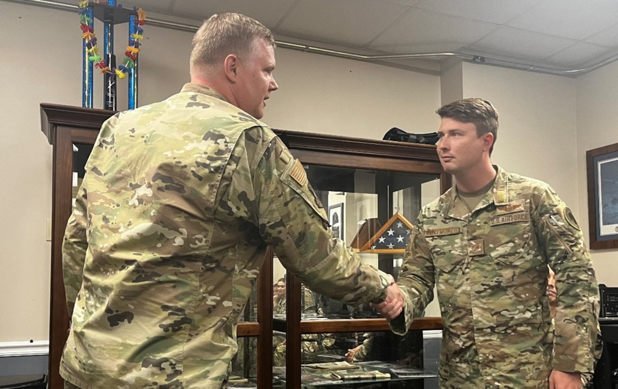 Col. Philip Warlick II, 655th Intelligence, Surveillance, and Reconnaissance (ISR) Wing commander, coins then-Tech. Sgt. Tristan Wentworth, 28th Intelligence Squadron, for being recognized as the Wing’s Air Force Intelligence, Surveillance and Reconnaissance Award Program (AFISRAP) Non-Commissioned Officer of the Year. Wentworth was promoted to master sergeant Nov. 1, 2023.