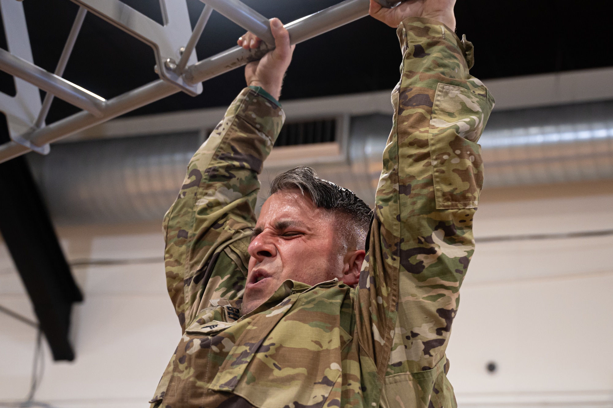 A U.S. Army Soldier performs pull-ups during the Holistic Health and Fitness Integrator Course.