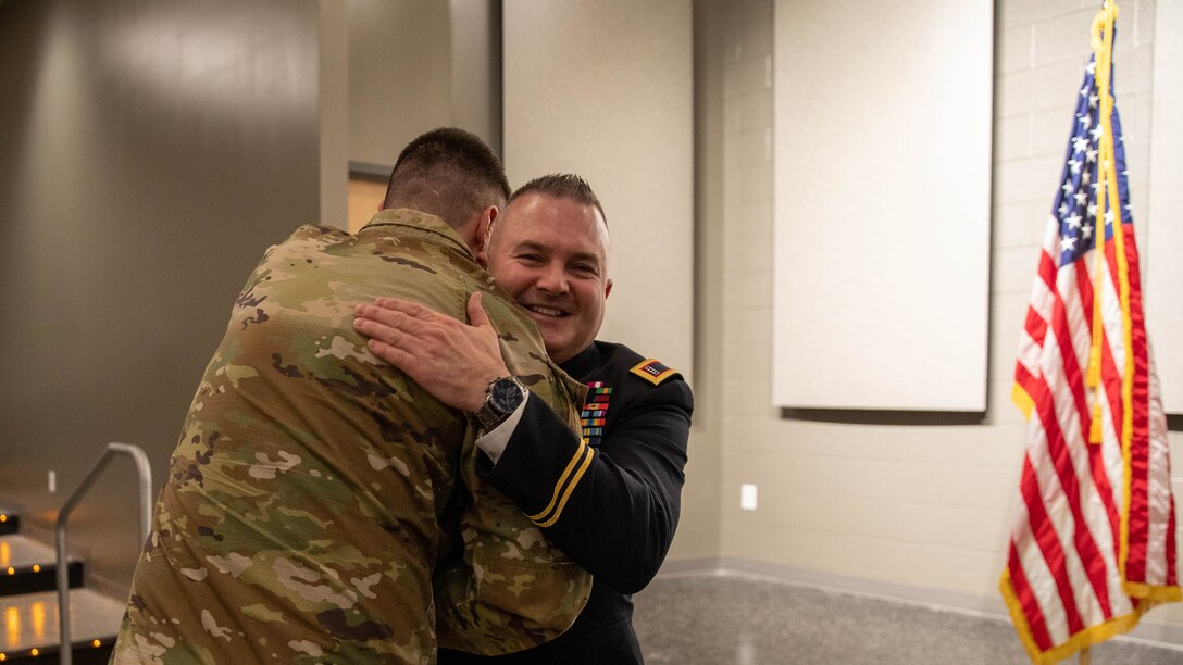 Chief Warrant Officer Four  Timothy Collins is congratulated for his promotion and his accomplishments during his promotion ceremony at the Wellman Auditorium on Boone Center in Frankfort, Kentucky, Jan. 22, 2024. He enjoyed the support from everyone. (Kentucky Army National Guard photo by Sgt. Destini Keene)
