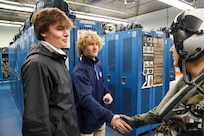 240122-N-MY408-1145 VIRGINIA BEACH, Va. (Jan. 22, 2024) Connor Robertson (left) and Chase Amos, two high school students from Advanced Technology Center’s Naval Architecture & Ocean Engineering course in Virginia Beach, cycle a M61A1 20-millimeter gatling gun while touring Strike Fighter Squadron (VFA) 106 “Gladiators” hangars and facilities at Naval Air Station Oceana. Robertson and Amos won the first-ever Naval Air Force Atlantic (AIRLANT) essay contest where they were provided an opportunity to join AIRLANT’s Force Master Chief Jimmy W. Hailey III for the day to learn more about naval aviation (U.S. Navy photo by Lt. j.g. Daniel Ehrlich)