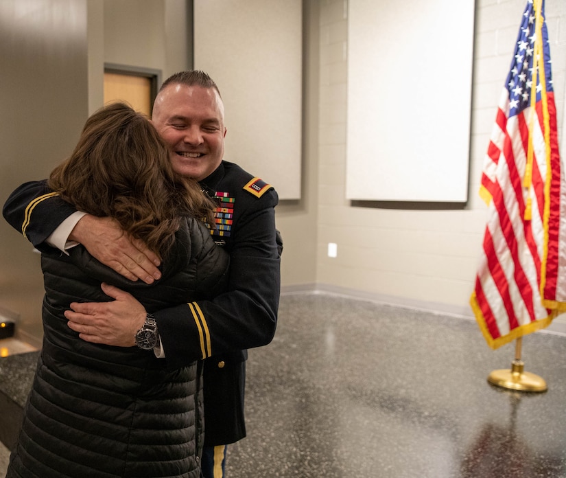 Chief Warrant Officer Four Timothy Collins is congratulated for his promotion and his accomplishments during his promotion ceremony at the Wellman Auditorium on Boone Center in Frankfort, Kentucky, Jan. 22, 2024.