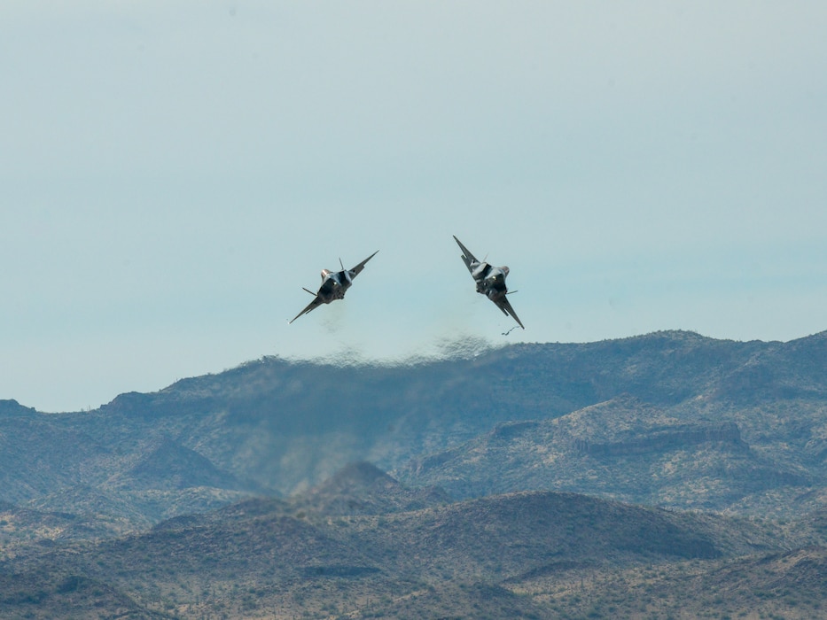 Two F-35 Lightning II assigned to the 56th Fighter Wing, perform an aerial maneuver over Barry M. Goldwater Range, Arizona, Jan. 19, 2024.