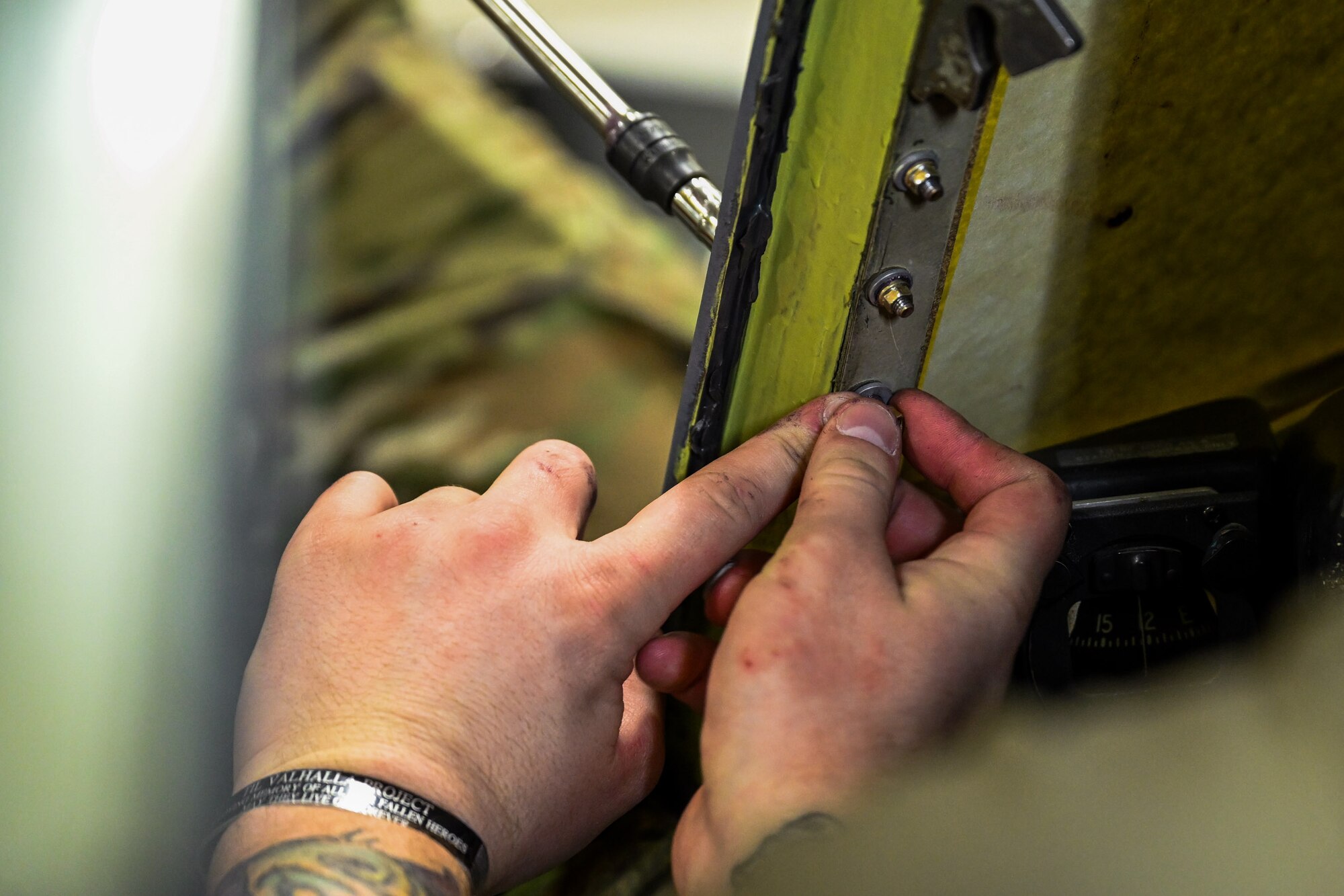 Master Sgt. Dan Scott, 910th Maintenance Squadron aircraft maintenance craftsman, and Staff Sgt. Creston Shirey, 910th Maintenance Squadron aircraft maintenance journeyman, install a new window on a C-130H Hercules aircraft at Youngstown Air Reserve Station, Ohio, Jan. 24, 2024.