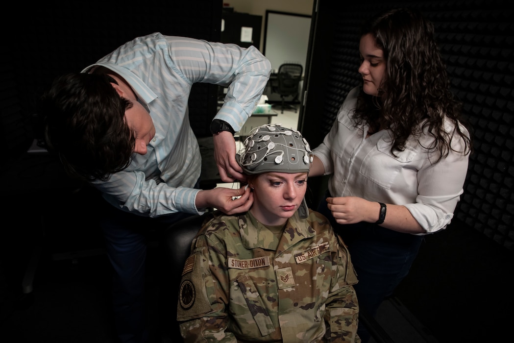 Image of two people treating a patient