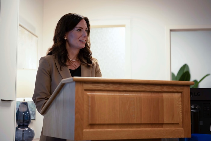 A person speaks at a podium.