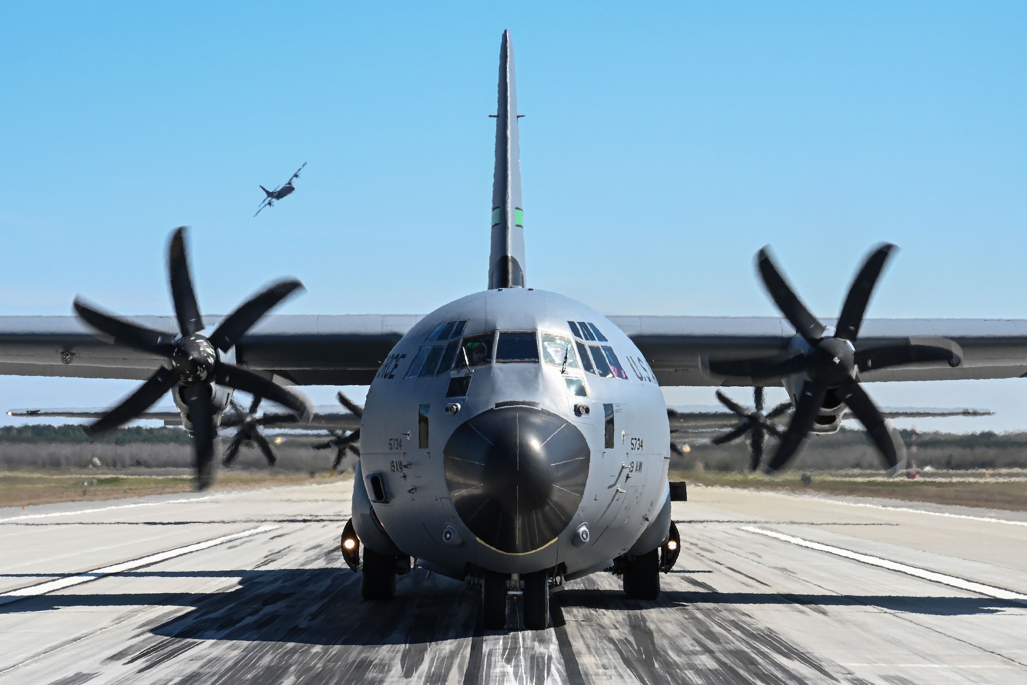 A C-130 sits on the flgihtline.