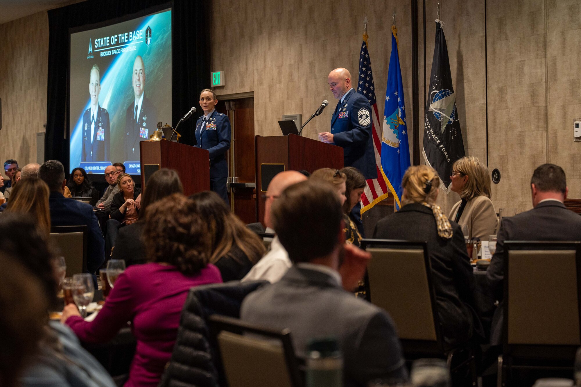 space base leaders speak in front of crowd.