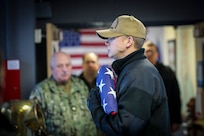 In a solemn gathering at the U.S. Navy Reserve Center on Joint Base Elmendorf-Richardson, sailors from the Alaska Naval Militia and U.S. Navy Reserve assembled Jan. 24, to pay homage to their fallen comrades lost 82 years ago.