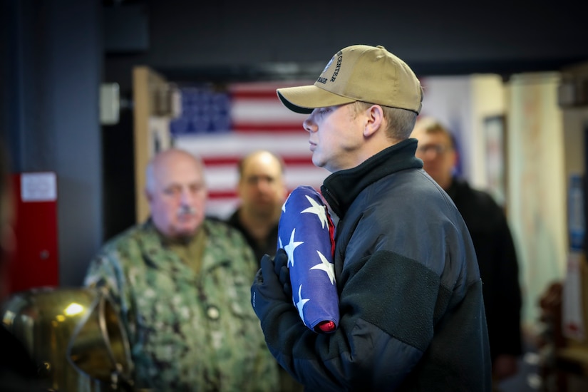 In a solemn gathering at the U.S. Navy Reserve Center on Joint Base Elmendorf-Richardson, sailors from the Alaska Naval Militia and U.S. Navy Reserve assembled Jan. 24, to pay homage to their fallen comrades lost 82 years ago.