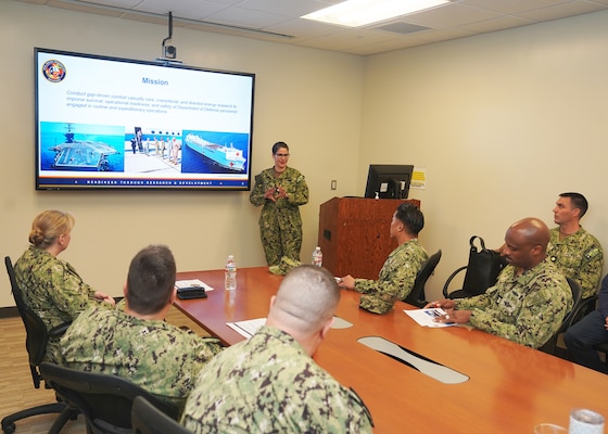 JOINT BASE SAN ANTONIO-FORT SAM HOUSTON – (Jan. 24, 2024) – Cmdr. Rachel Werner, acting chief science director, Naval Medical Research Unit (NAMRU) San Antonio, briefs Force Master Chief PatrickPaul Mangaran, director, Hospital Corps, U.S. Navy Bureau of Medicine and Surgery (BUMED), and staff, on the unit’s mission and capabilities during Mangaran’s visit to the Tri-Service Research Laboratory.  NAMRU San Antonio’s mission is to conduct gap driven combat casualty care, craniofacial, and directed energy research to improve survival, operational readiness, and safety of Department of Defense (DoD) personnel engaged in routine and expeditionary operations. It is one of the leading research and development laboratories for the U.S. Navy under the DoD and is one of eight subordinate research commands in the global network of laboratories operating under the Naval Medical Research Command in Silver Spring, Md. (U.S. Navy photo by Burrell Parmer, NMFSC Public Affairs/Released)