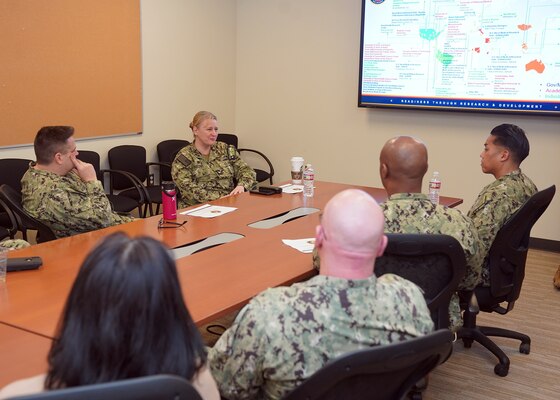 JOINT BASE SAN ANTONIO-FORT SAM HOUSTON – (Jan. 24, 2024) – Capt. Jennifer Buechel, commanding officer, Naval Medical Research Unit (NAMRU) San Antonio, speaks with Force Master Chief PatrickPaul Mangaran, director, Hospital Corps, U.S. Navy Bureau of Medicine and Surgery (BUMED), and staff, during Mangaran’s visit to the Tri-Service Research Laboratory.  NAMRU San Antonio’s mission is to conduct gap driven combat casualty care, craniofacial, and directed energy research to improve survival, operational readiness, and safety of Department of Defense (DoD) personnel engaged in routine and expeditionary operations. It is one of the leading research and development laboratories for the U.S. Navy under the DoD and is one of eight subordinate research commands in the global network of laboratories operating under the Naval Medical Research Command in Silver Spring, Md. (U.S. Navy photo by Burrell Parmer, NMFSC Public Affairs/Released)