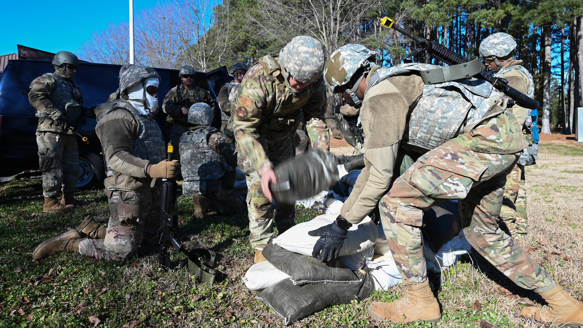 U.S. Airmen assigned to the 4th Civil Engineer Squadron build a defense fighting position during a bivouac training exercise at Seymour Johnson Air Force Base, North Carolina, Jan. 18, 2024. The bivouac training tested the squadron's ability to secure and establish base operations infrastructure within a timely manner and conduct contingency and wartime operations if the opportunity were to arise. (U.S. Air Force Photo by Airman Rebecca Tierney)