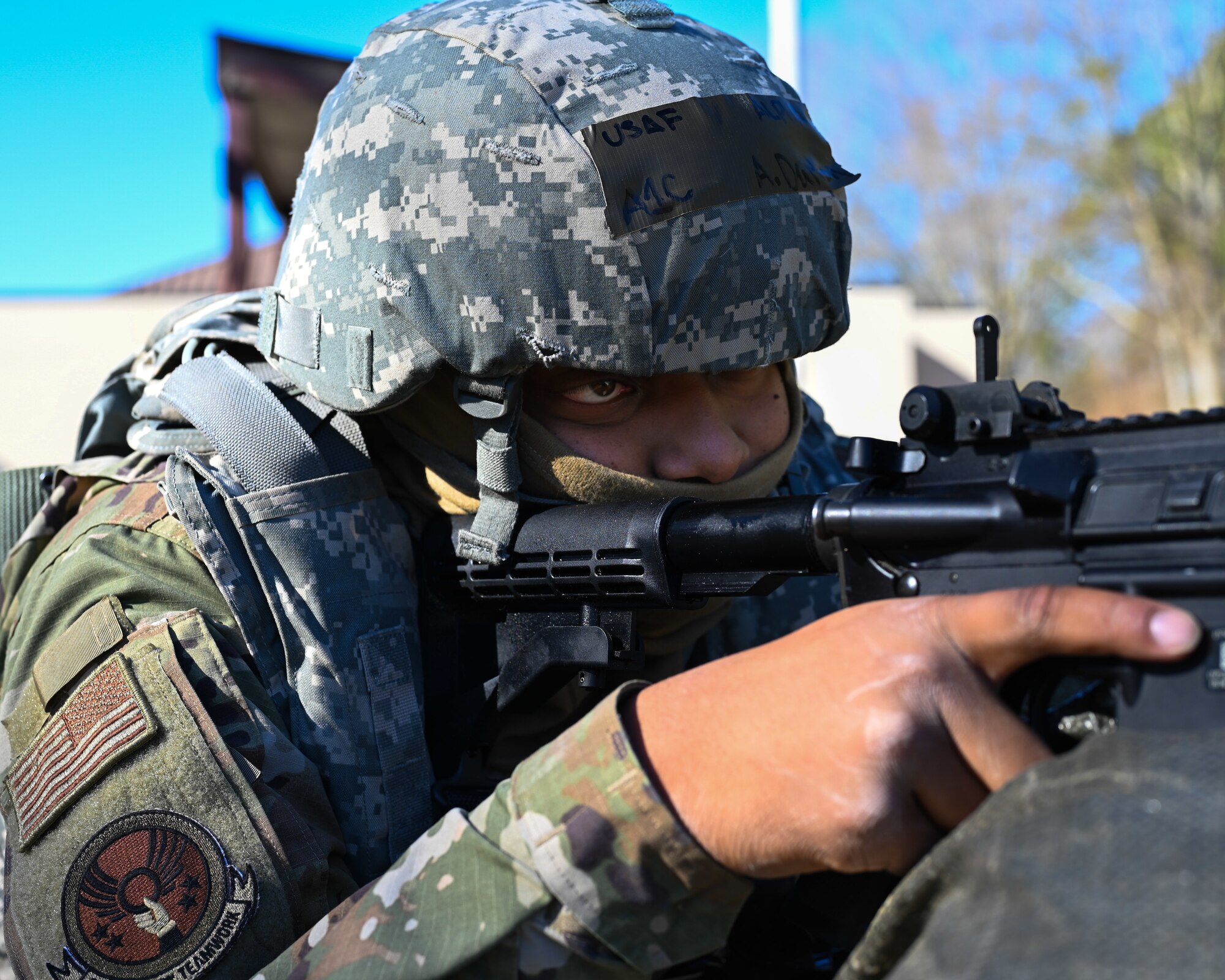 U.S. Airman 1st Class Aaron Dalton, a structures apprentice assigned to the 4th Civil Engineer Squadron, defends his position during a bivouac training exercise at Seymour Johnson Air Force Base, North Carolina, Jan. 18, 2024. The bivouac training tested the squadron's ability to secure and establish base operations infrastructure within a timely manner and conduct contingency and wartime operations if the opportunity were to arise. (U.S. Air Force Photo by Airman Rebecca Tierney)
