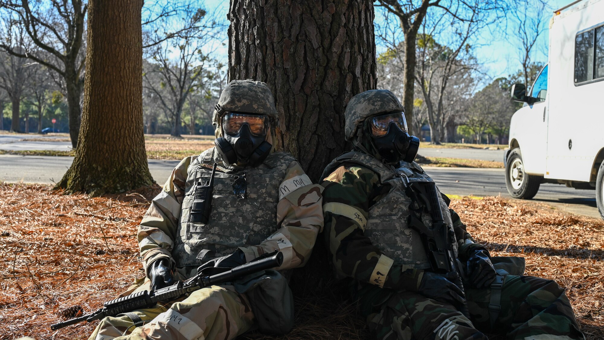 U.S. Airmen assigned to the 4th Civil Engineer Squadron rest during a bivouac training exercise at Seymour Johnson Air Force Base, North Carolina, Jan. 18, 2024. Over the course of the exercise, participants practiced building defensive fighting positions, responded to vehicle checkpoints, and performed post-attack reconnaissance sweeps , while demonstrating their ability to survive and operate in a hostile environment. (U.S. Air Force Photo by Airman Rebecca Tierney)