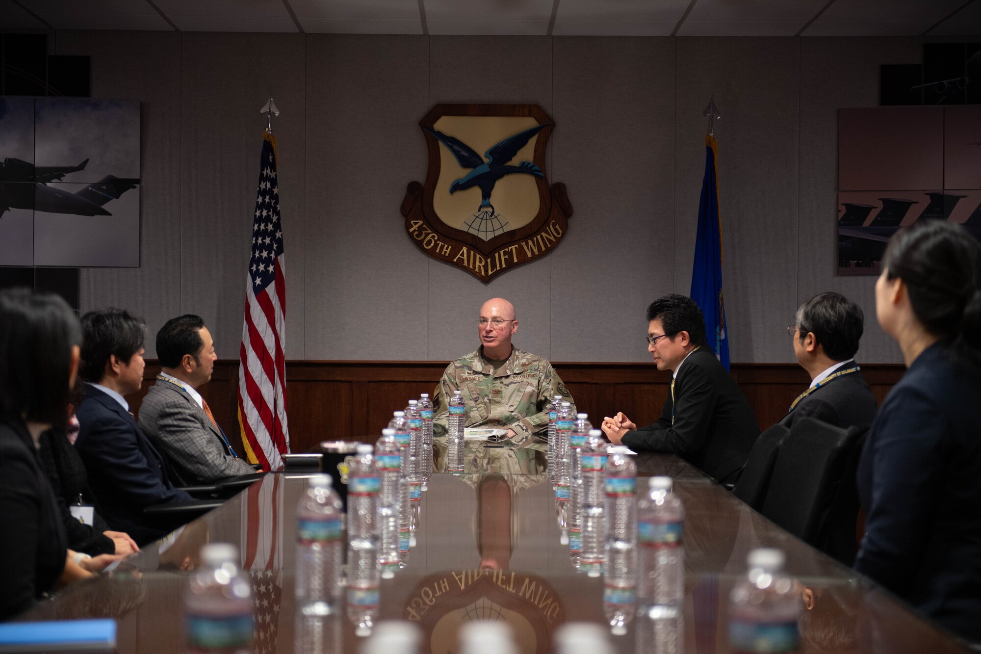 U.S. Air Force Col. Chris McDonald, 436th Airlift Wing commander, converses with members of the Miyagi Prefecture delegation from Japan at Dover Air Force Base, Delaware, Jan. 23, 2024. The delegation met with 436th Airlift Wing leadership to embody the growing bond between the “sister cities.” (U.S. Air Force photo by Tech. Sgt. J.D. Strong II)