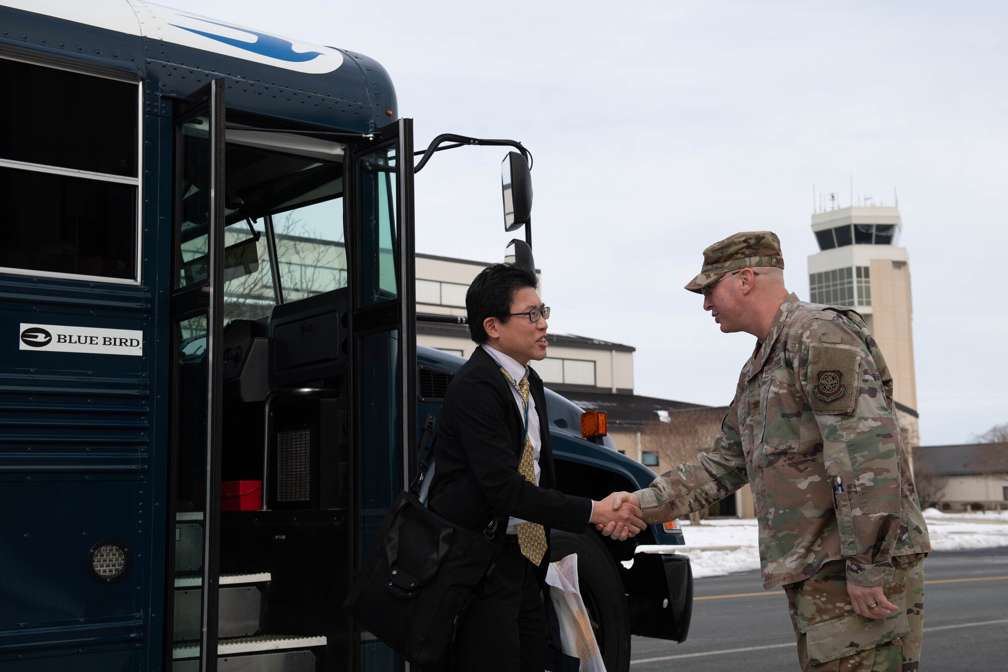 U.S. Air Force Col. Chris McDonald, 436th Airlift Wing commander, greets a member of the Miyagi Prefecture delegation from Japan at Dover Air Force Base, Delaware, Jan. 23, 2024. The delegation met with 436th Airlift Wing leadership to embody the growing bond between the “sister cities.” (U.S. Air Force photo by Tech. Sgt. J.D. Strong II)