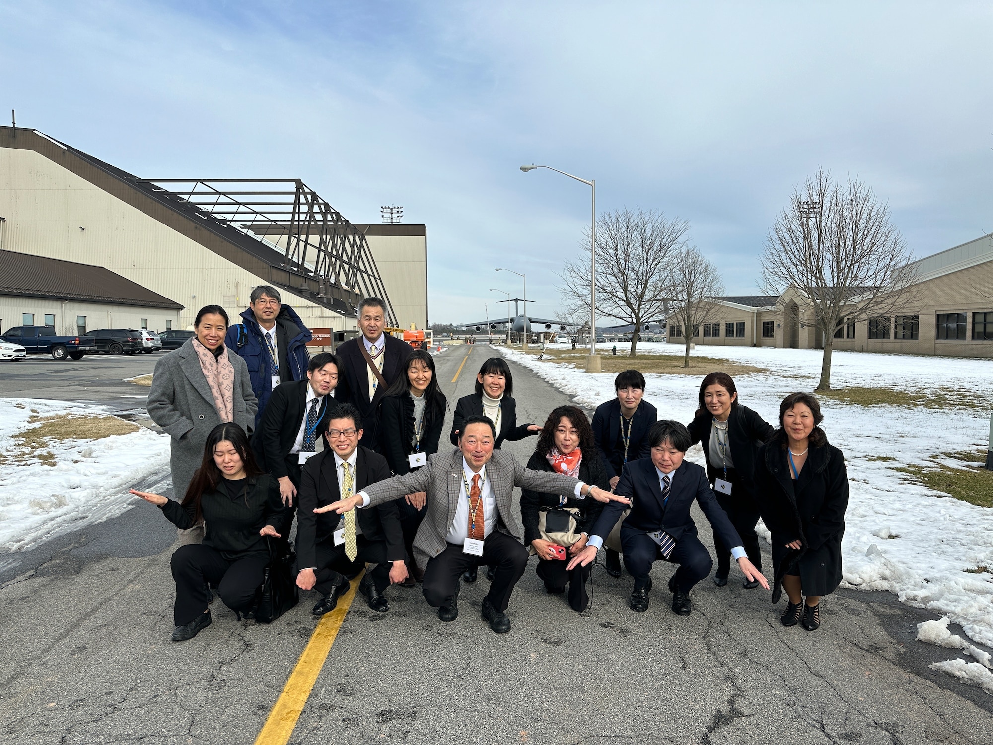Members of the Miyagi Prefecture delegation from Japan, pose for a group photo at Dover Air Force Base, Delaware, Jan. 23, 2024. The delegation met with 436th Airlift Wing leadership to embody the growing bond between the “sister cities.” (U.S. Air Force photo by Zachary Cacicia)