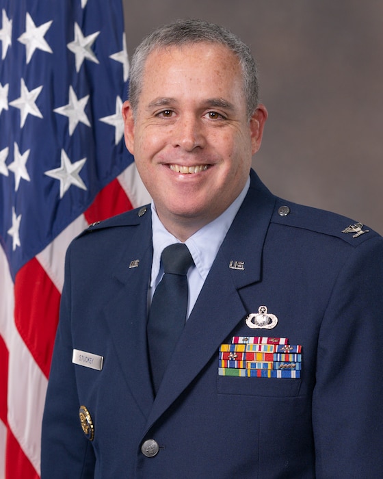 Col Nathan Stuckey bio photo. Man in dress blue USAF uniform.