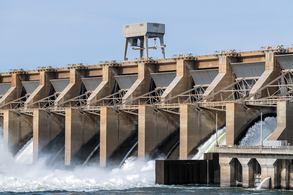 A crane sits on top of the spillway at the Ice Harbor Dam on the Snake River in Washington. The U.S. Army Corps of Engineers operates and maintains approximately 740 dams and associated structures that provide significant benefits to the nation.