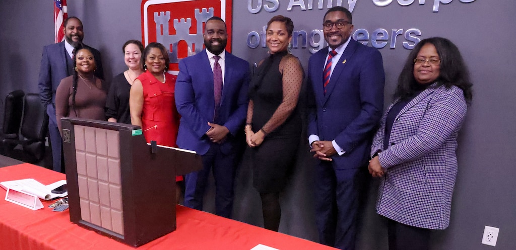 Members of the U.S. Army Corps of Engineers, Mobile District pose with Dr. Olivier Charles, President of Bishop State Community College, center, during the Dr. Martin Luther King, Jr. lunch and learn celebration at the District Office, Mobile, Alabama, Jan. 24, 2024.