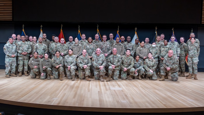 New York Air and Army National Guard chaplains and enlisted religious affairs specialists pose for a photo during the state's annual joint religious sustainment training in Syracuse, NY, Jan. 08. During the training the servicemembers discussed their experiences and shared best practices for conducting religious affairs programs throughout the New York Air and Army National Guards. (U.S. Air Force photo by Alexander Rector)