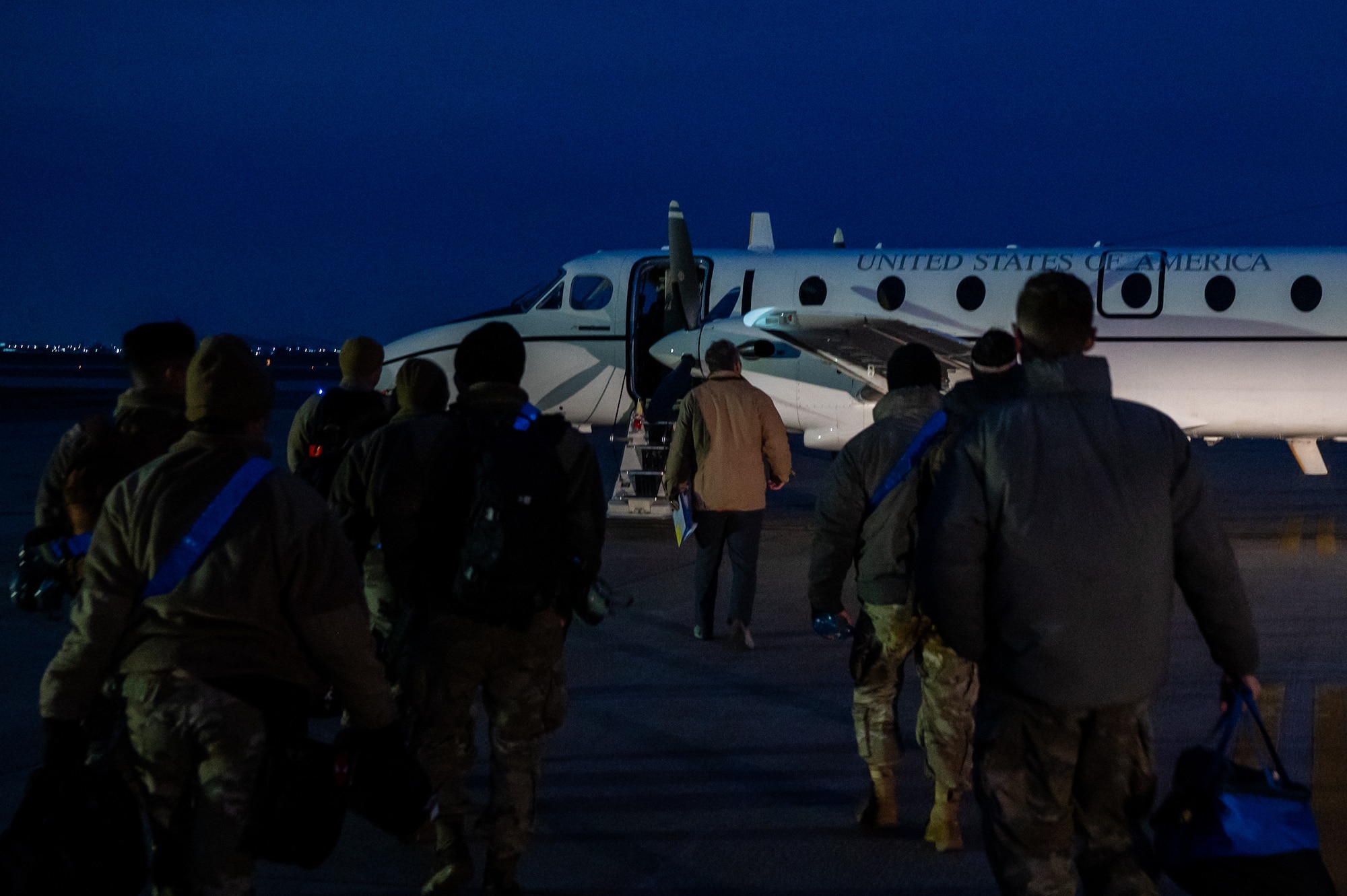 Members of the 35th Fighter Generation Squadron board an MC-12 Liberty before flying.
