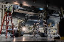 Weapons load crew Airmen from the 5th Aircraft Maintenance Squadron compete to see who can load an inert AGM-158 Joint Air to Surface Standoff Missile (JASSM) onto a B-52H Stratofortress first at Minot Air Force Base, North Dakota, Jan. 19, 2024. Airmen are judged on not only how fast and accurately they can load the JASSM, but also on their dress and appearance, as well as a written exam.