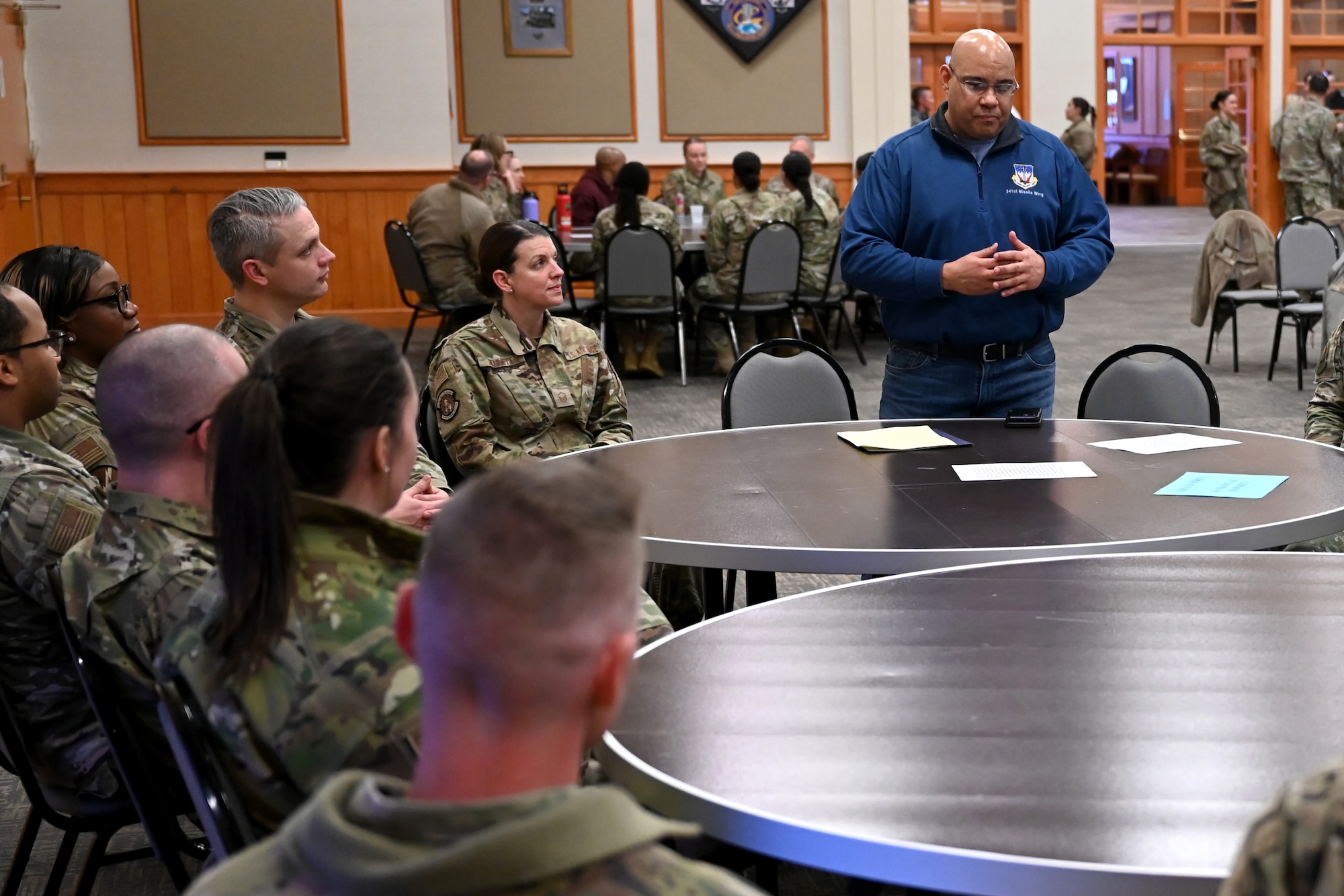 Airmen participate in a guided discussion during a MLK remembrance event.