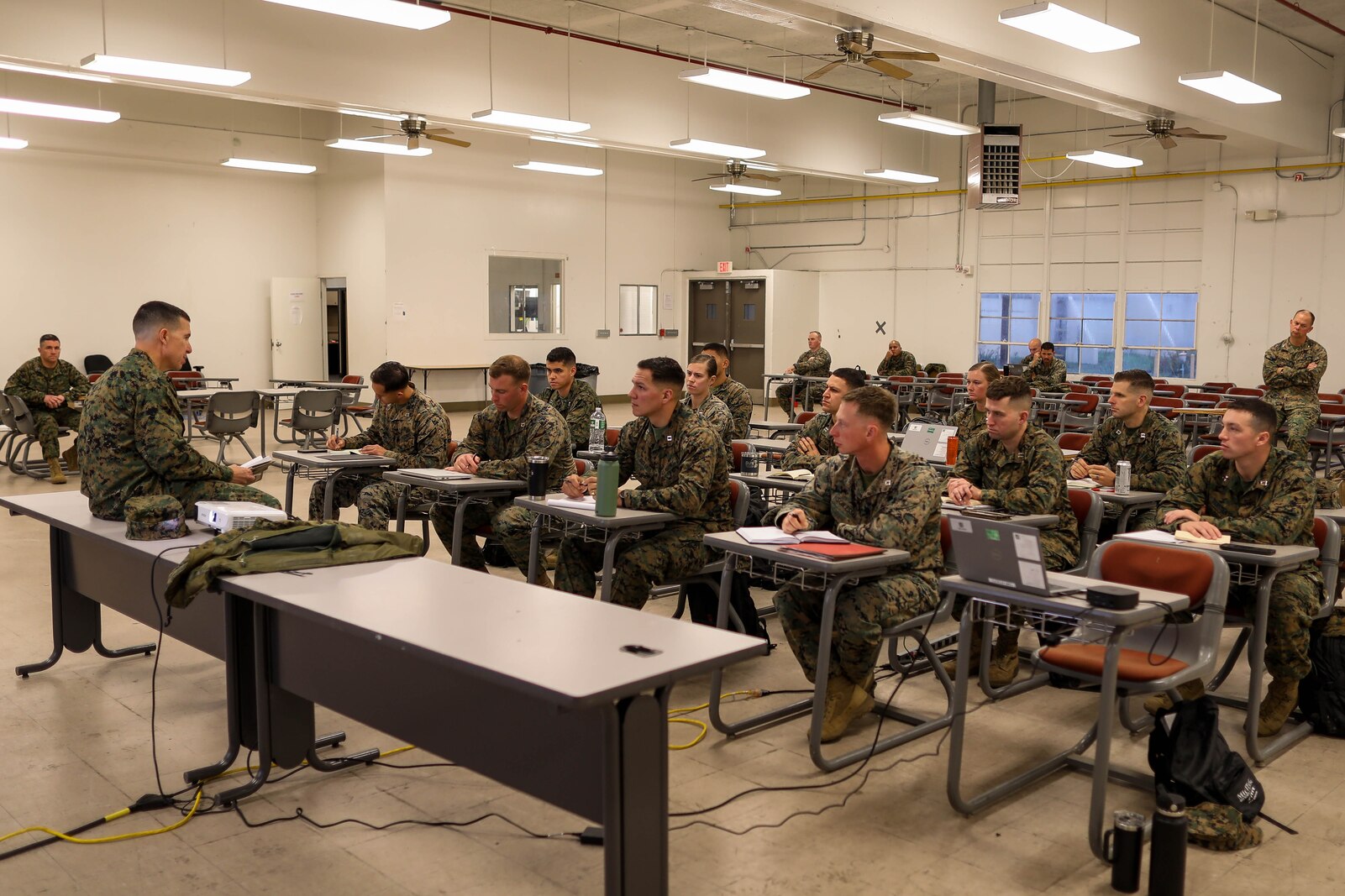U.S. Marine Corps Maj. Gen. Benjamin T. Watson, left, the commanding general of 1st Marine Division, addresses students of the Division Schools’ company commanders course at Marine Corps Base Camp Pendleton, California, Jan. 22, 2024. The division instituted the company commanders course to better prepare officers for company and battery command. (U.S. Marine Corps photo by Lance Cpl. Andrew Whistler)