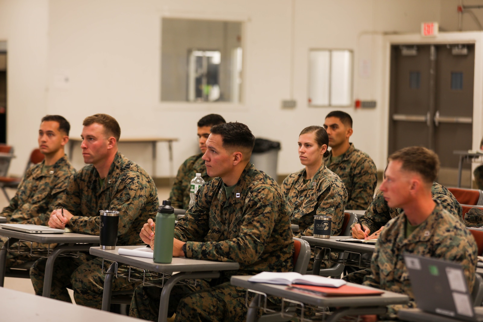 U.S. Marine officers from across 1st Marine Division listen to a speech given by Maj. Gen. Benjamin T. Watson, the commanding general of 1st MARDIV, during Division Schools’ company commanders course at Marine Corps Base Camp Pendleton, California, Jan. 22, 2024. The division instituted the company commanders course to better prepare officers for company and battery command. (U.S. Marine Corps photo by Lance Cpl. Andrew Whistler)