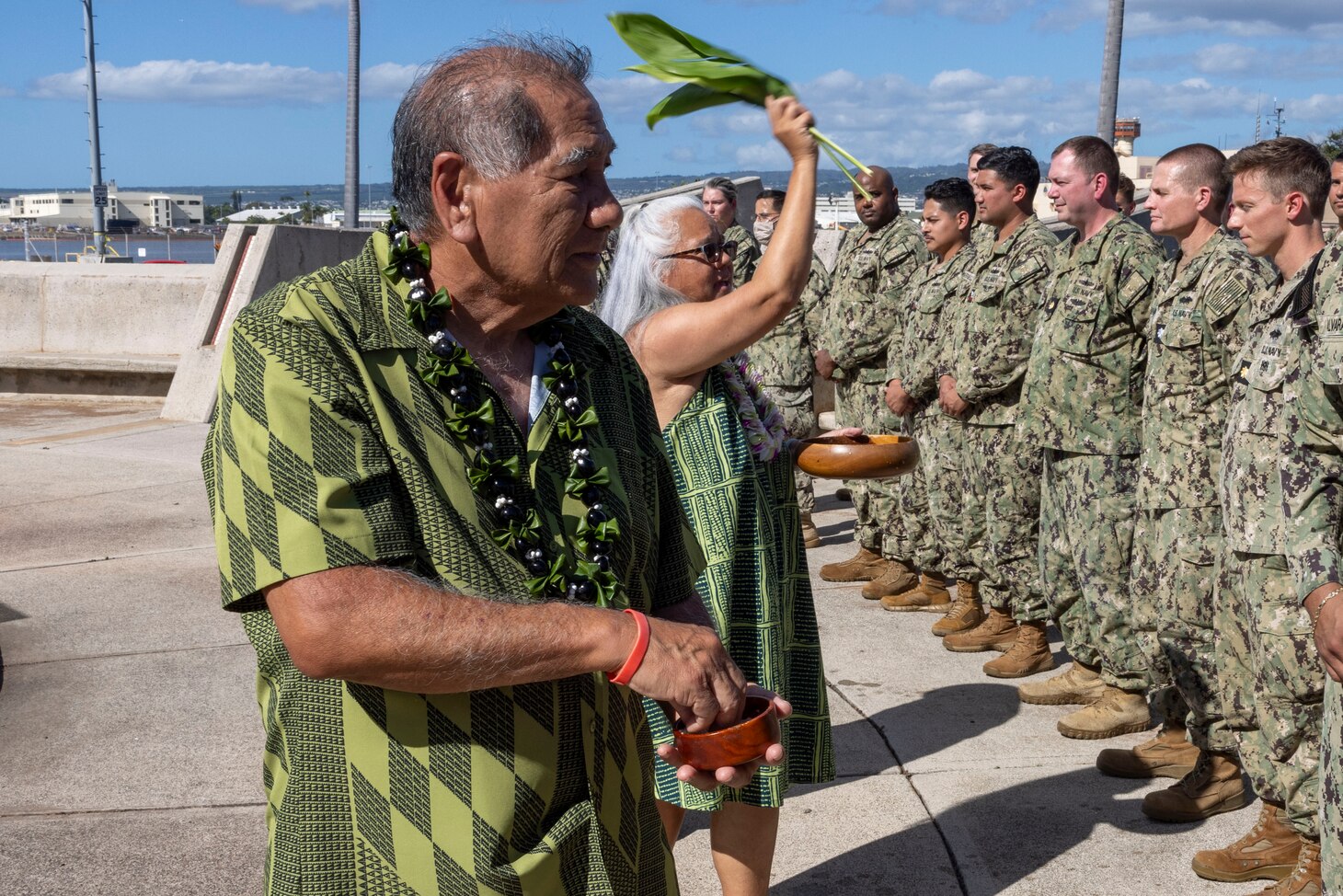 JOINT BASE PEARL HARBOR – HICKAM, Hawaii (Jan. 18, 2024) Hawaiian Kahu Bruce Keaulani and Aunty Kehaulani Lum give the members of Navy Closure Task Force – Red Hill (NCTF-RH) a Hawaiian blessing during a Plank Owner Ceremony at Joint Base Pearl Harbor – Hickam, Jan. 18, 2024. Charged with the safe closure of the Red Hill Bulk Fuel Storage Facility (RHBFSF), NCTF-RH was established by the Department of the Navy as a commitment to the community and the environment. The task force is forming and expects take on responsibilities for Red Hill from Joint Task Force-Red Hill in early Spring 2024. NCTF-RH continues to engage in conversations in formal and informal forums with the people of Hawaii, regulatory agencies, and experts and officials to keep stakeholders informed as the Navy works to safely and deliberately close the RHBFSF. (U.S. Navy photo by Mass Communications Specialist 1st Class Luke McCall)