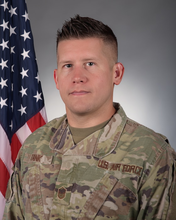 U.S. Air Force Master Sgt. Kristopher Tank poses for an official military portrait Dec. 21, 2023 at Truax Field, Madison, Wisconsin.