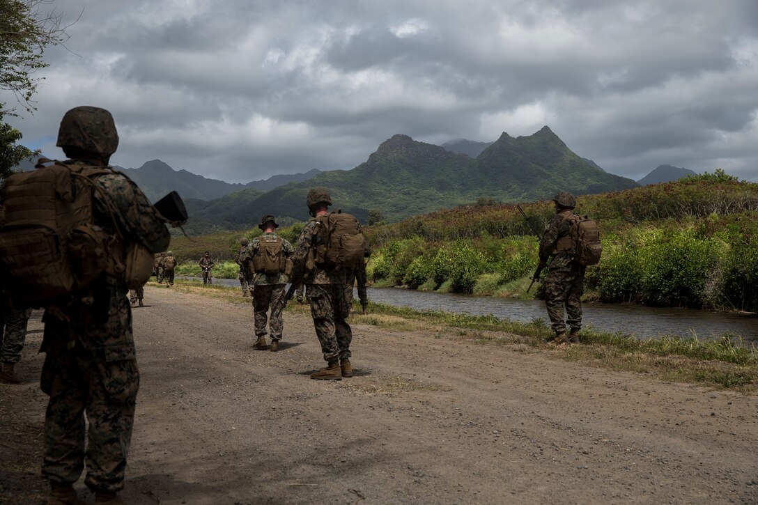 U.S. Marines with 3rd Radio Battalion, III Marine Expeditionary Force Information Group, conduct patrol exercises at Marine Corps Training Area Bellows, Hawaii, Jun. 27, 2018. The training opportunity fortified basic Marine skills and reaffirmed combat training techniques.