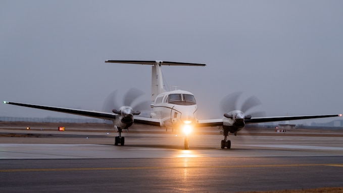 An MC-12 Liberty taxis before taking off.