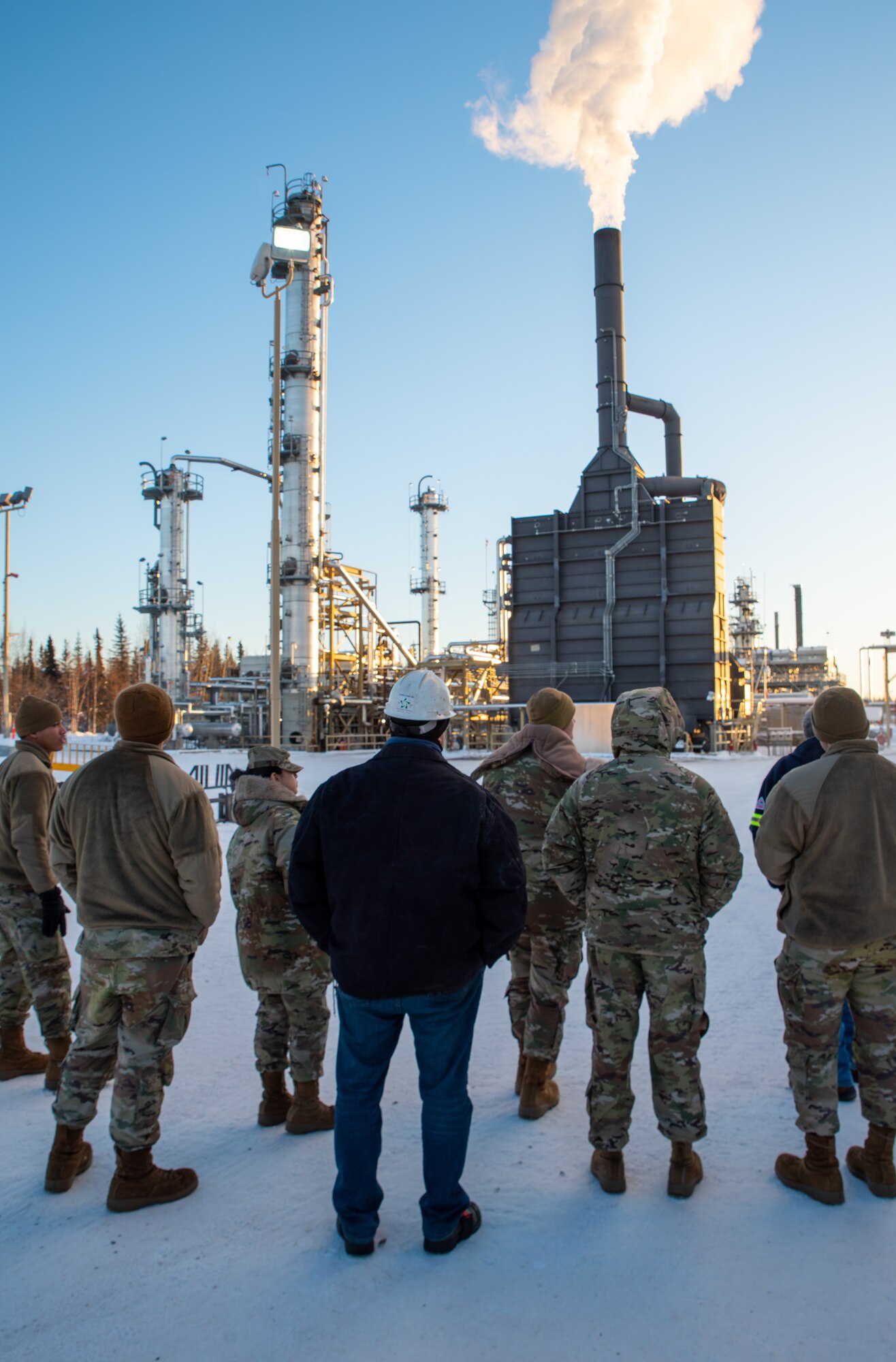 Petro Star Inc. employees, 354th Logistics Readiness Squadron Airmen, and 354th Fighter Wing leadership view the Petro Star Inc. Oil Refinery in North Pole, Alaska, on Jan. 22, 2024.