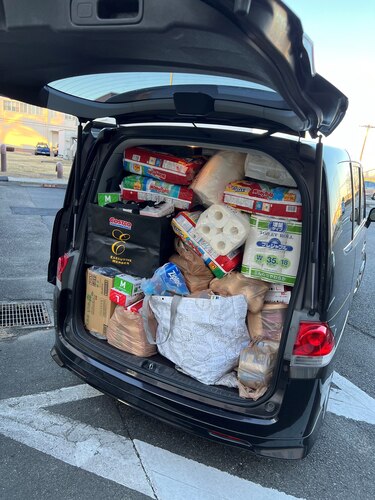 Donations from Team Yokota fill the trunk of Chad Griffin’s personal vehicle.