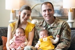 Airman, his wife, and twin infant daughters